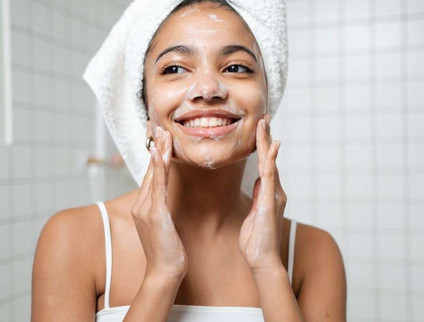 woman washing her face